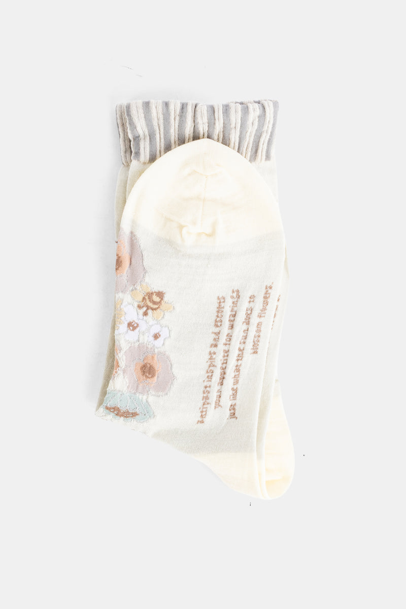Antipast chaussettes écrues verso inscription brodée dorée motif fleurs aquarelle pastel et revers rayé gris
