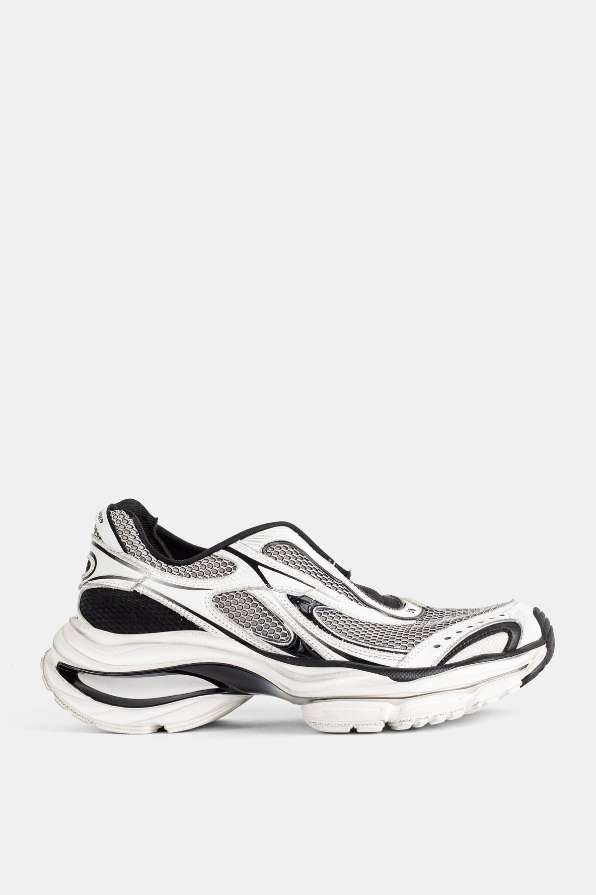 Balenciaga men's D'Orsay slip-on sneakers in white and black mesh with sculpted sole, side profile view.