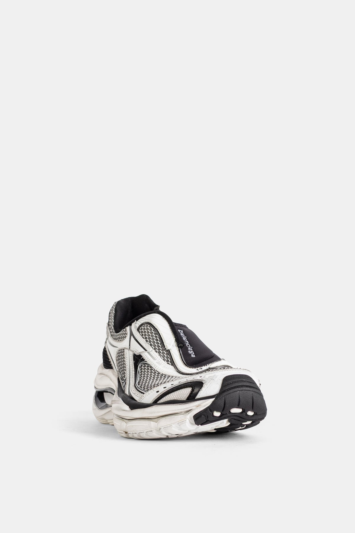 Balenciaga men's D'Orsay sneakers in white hexagonal mesh with a black rubber toe cap, three-quarter front view.