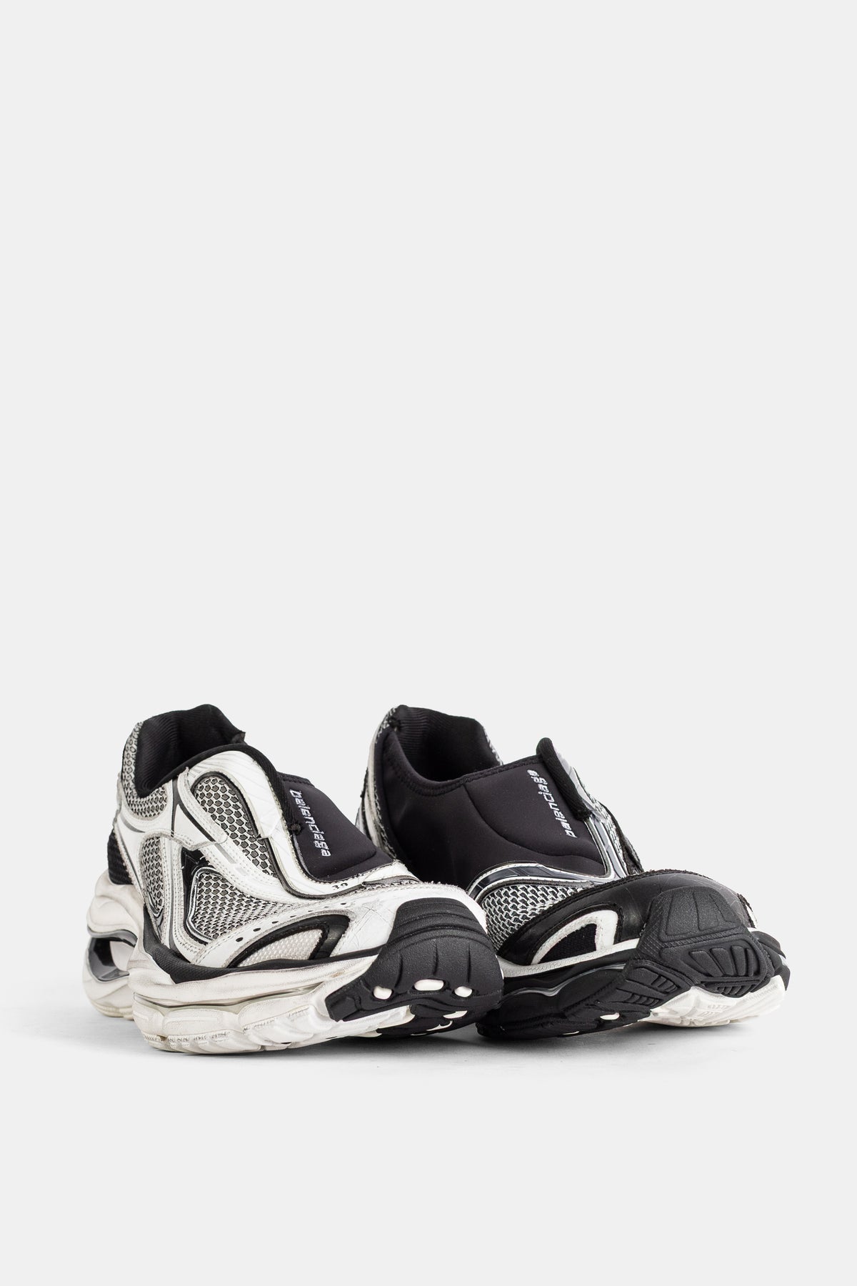 Balenciaga men's D'Orsay slip-on rear view with black heel, sock collar and sculpted counter in white mesh.