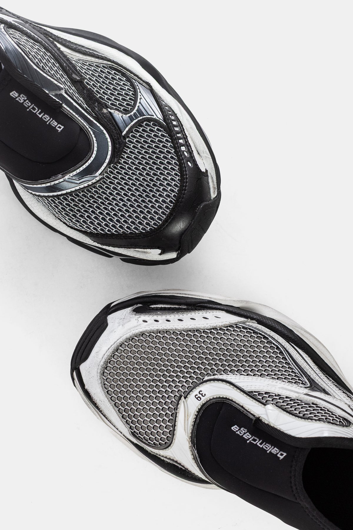 Balenciaga men's D'Orsay slip-on top view of the pair in silver grey hexagonal mesh, size 39 with black insole.