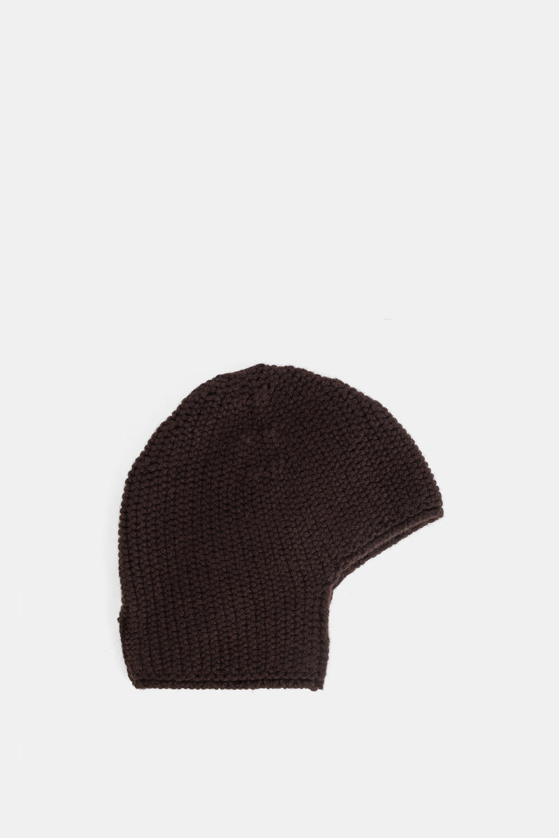 Casey Casey Rover beanie in a textured garter-stitch knit with ear flaps, in a deep chocolate brown color.