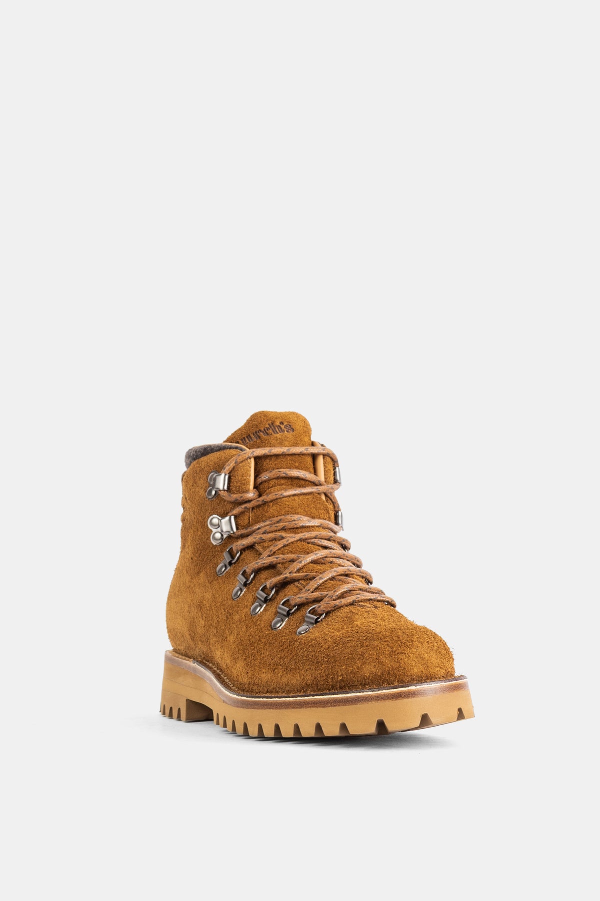 Church's men's boot in caramel suede with silver metal lace hooks and a chunky protective rubber lug sole.