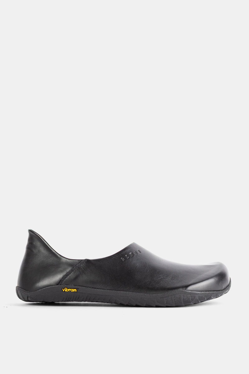 Demon Dalmara slip-on mule in black smooth leather with a Vibram sole and minimalist unisex silhouette.