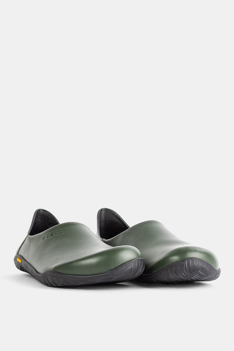 Pair of Demon Dalmara olive green leather mules, three-quarter rear view showing textured black sole.