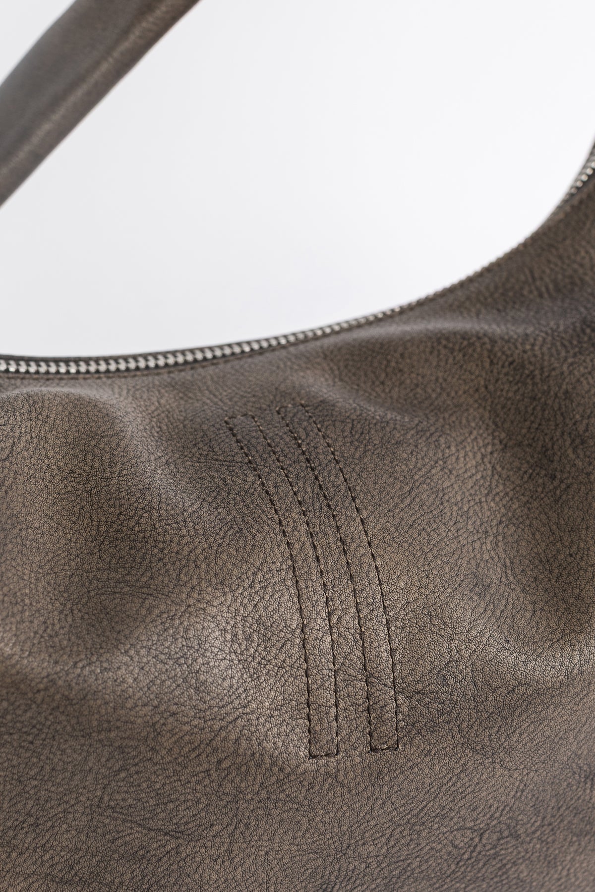Rick Owens Cropped Gemini Bag Washed detail of parallel stitching, matte bronze leather and silver zipper