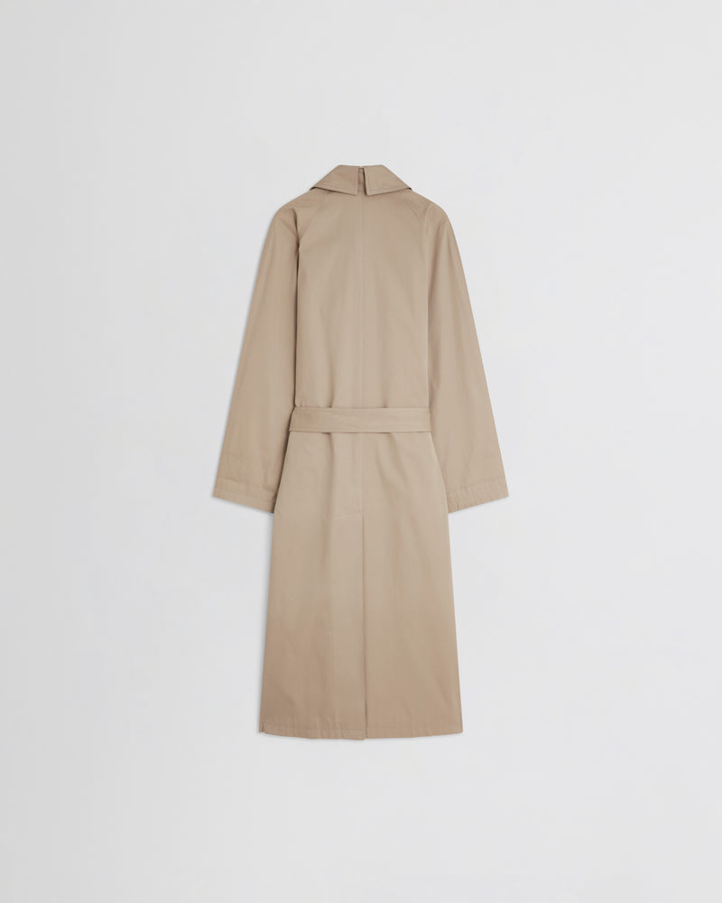Phoebe Philo trench femme dos, coton sable, ceinture centrée et vent arrière structuré