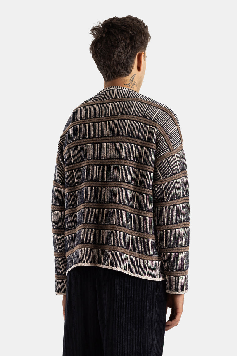 Giorgio Armani boxy striped silk wool sweater in brown, black and white, back view with neck tattoo.