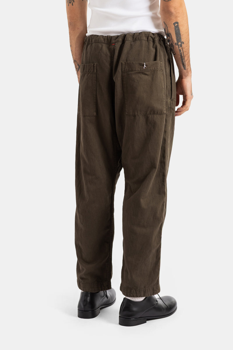 Casey Casey Tie Me Up trousers back view with patch pockets in washed khaki cotton styled with black derbies.