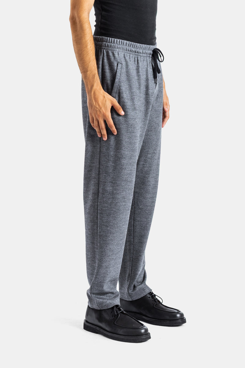 Pantalón Vitale Harris Wharf para hombre vista lateral cintura elástica cordón negro lana gris jaspeado.