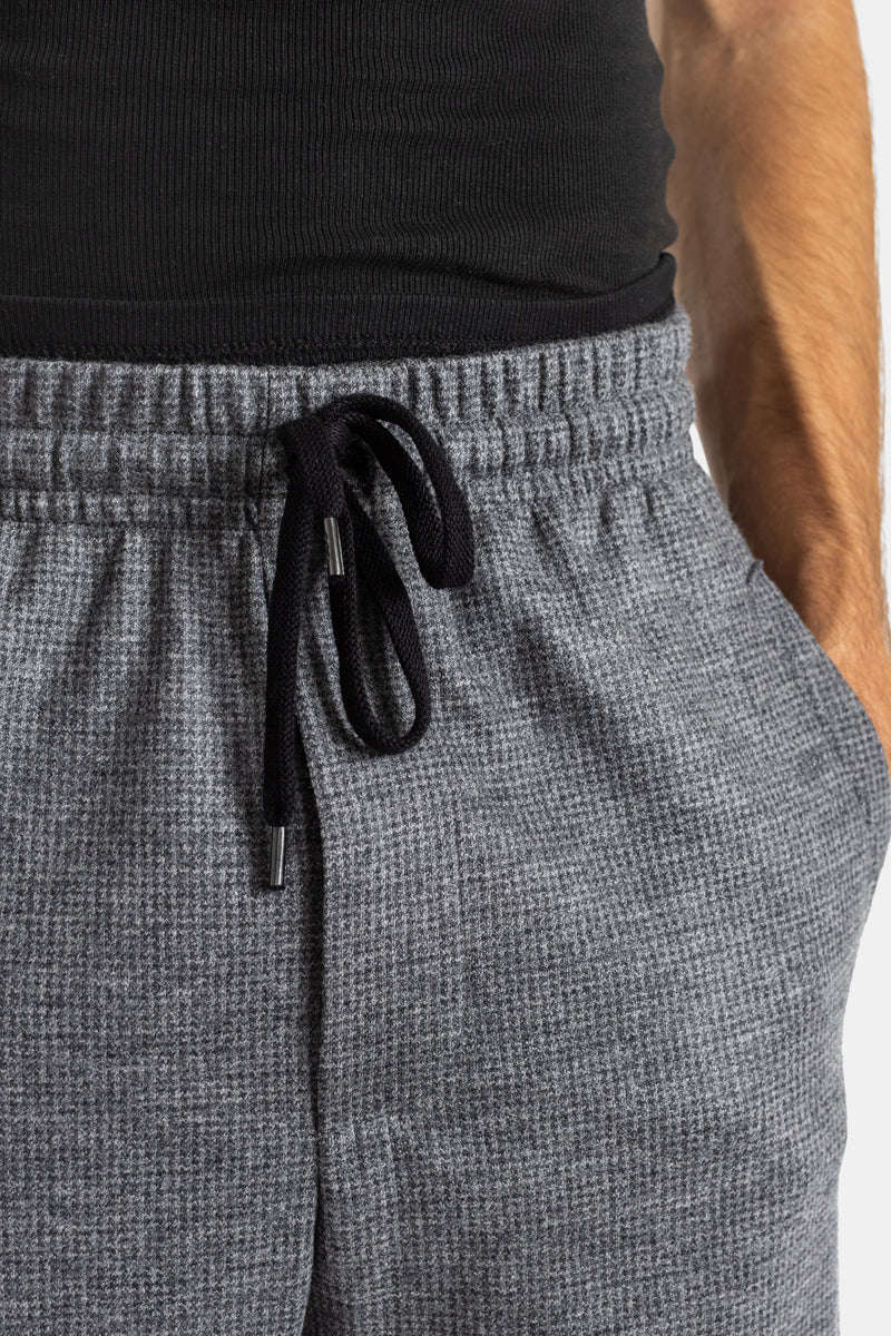 Zoom pantalón Vitale Harris Wharf cordón negro herrajes de metal cintura elástica lana gris jaspeado.
