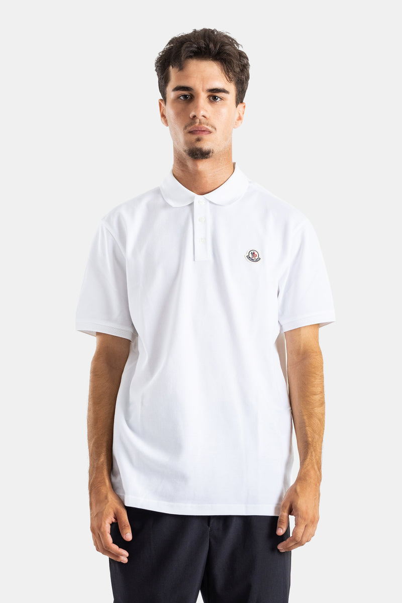 Moncler men's white cotton piqué polo shirt, straight fit, buttoned collar, short sleeves, embroidered logo.