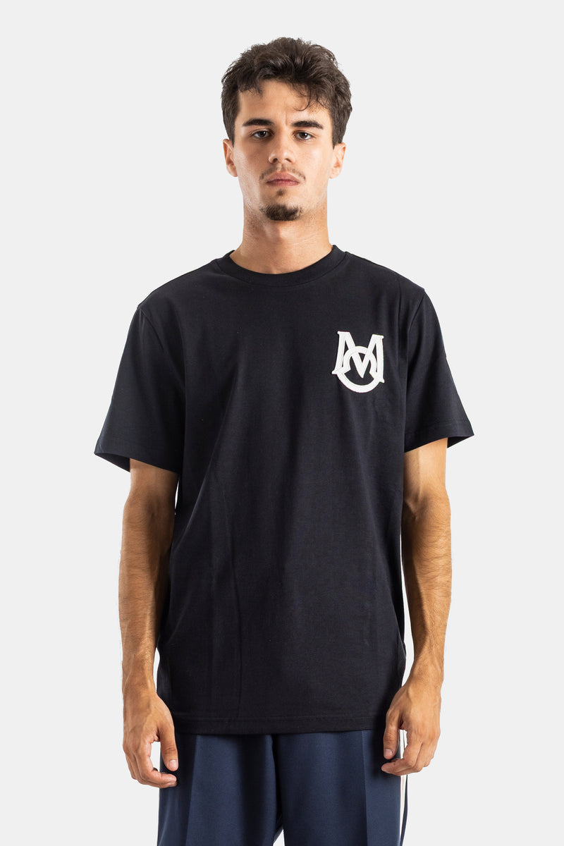 T-shirt Moncler oversize de gola redonda e manga curta em algodão preto com monograma bordado para homem.
