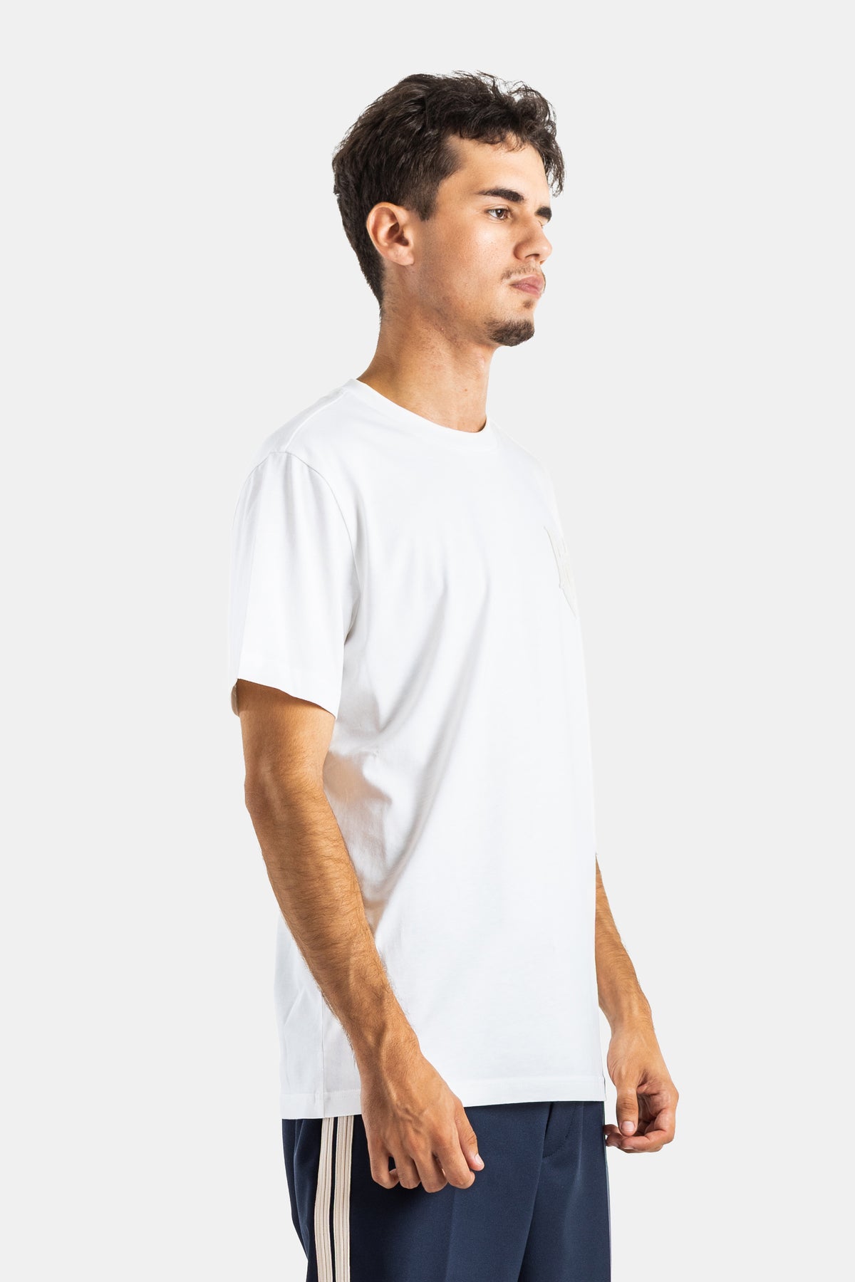 Side view of Moncler men's white cotton T-shirt with a straight cut, short sleeves, and chest pocket