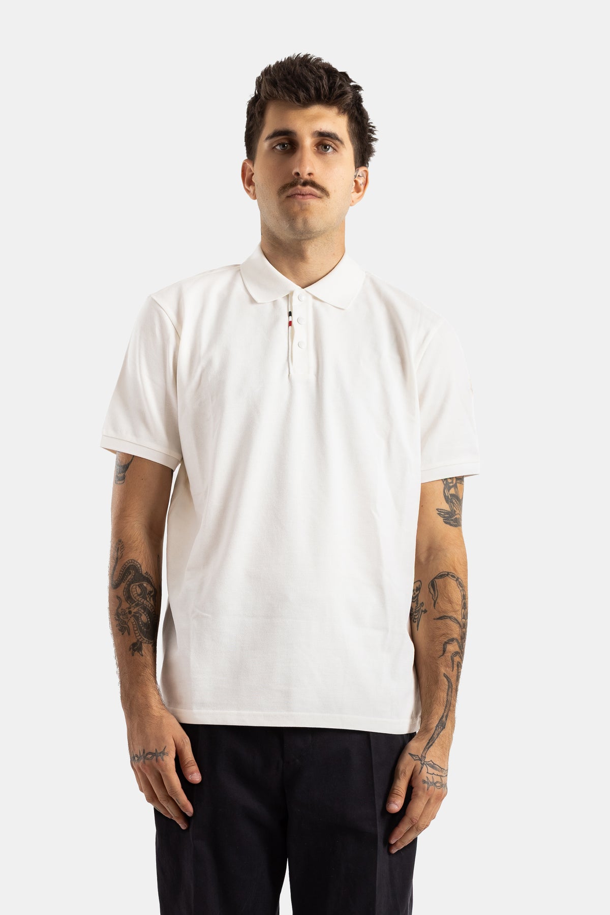 Moncler polo piqué coton blanc coupe ample col boutonné liseré tricolore manches courtes homme