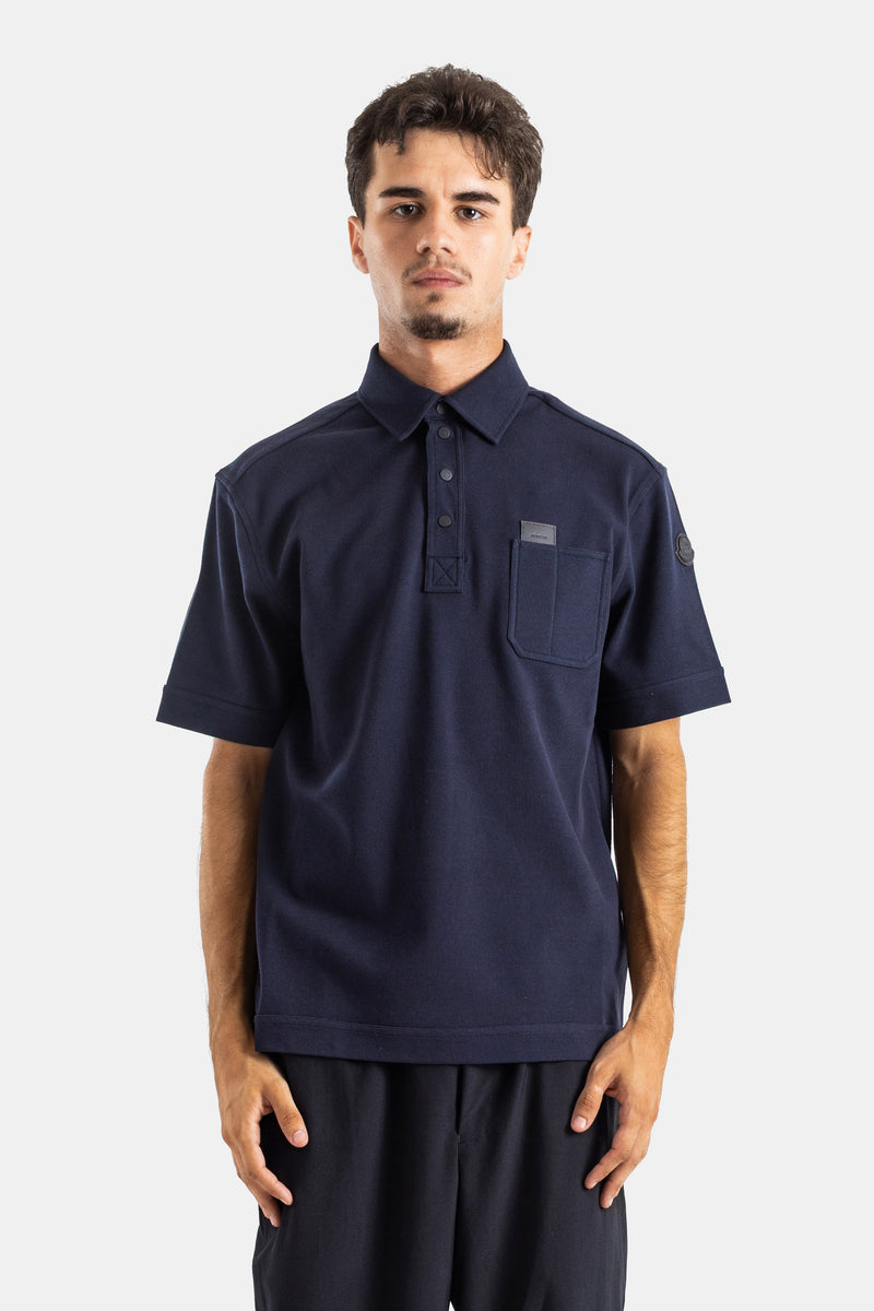 Moncler polo coton coupe relaxed col boutonné manches courtes poche poitrine patch logo cuir bleu marine
