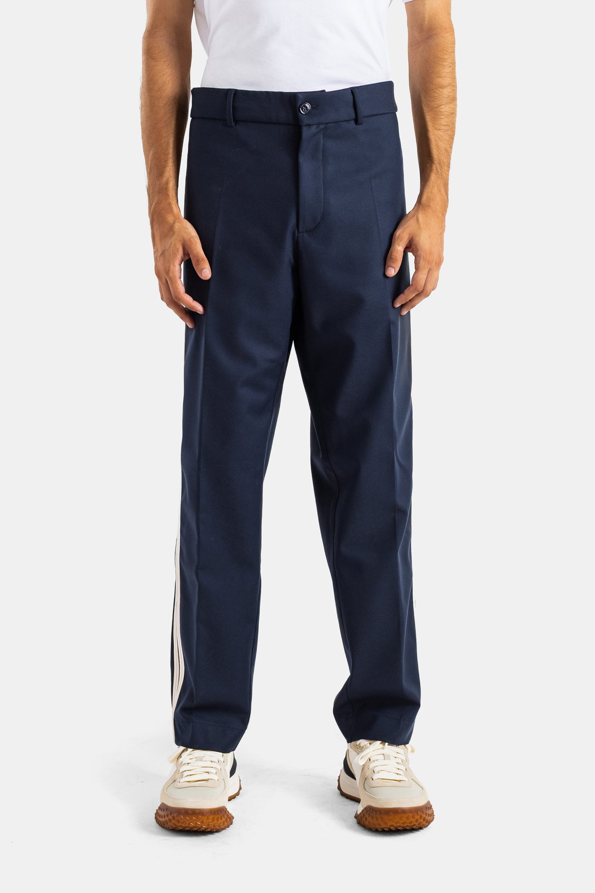Moncler men's straight-cut navy blue trousers with side stripes, tailored in a structured dense wool fabric.