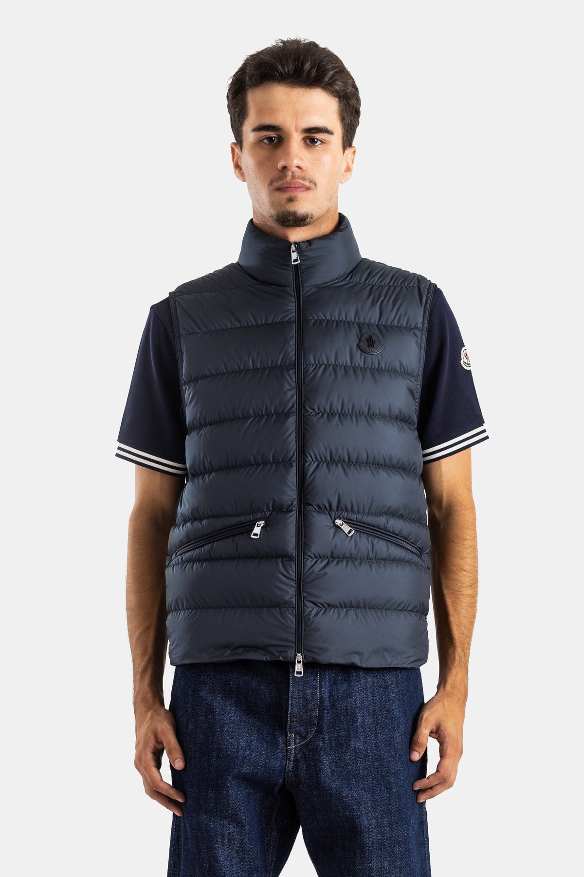Quilted Moncler Treompan men's sleeveless down jacket in navy blue featuring a protective stand-up collar.
