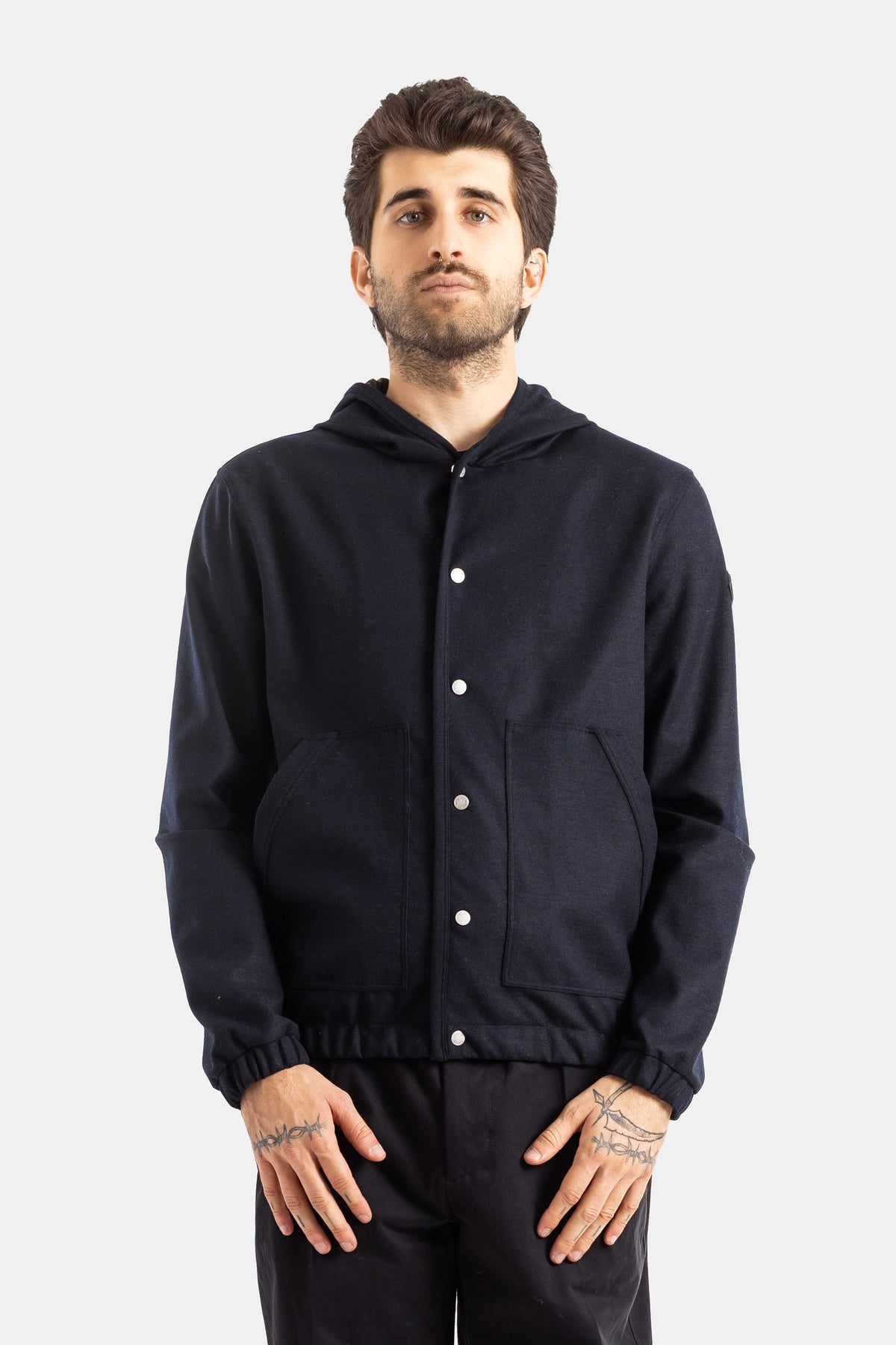 Moncler hooded navy blue wool bomber jacket with straight fit, silver snap buttons and front patch pockets