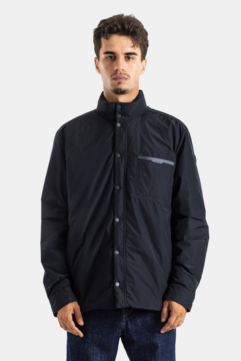 Oversized Moncler Yndale men's down jacket in black technical fabric with a high snap-button collar.
