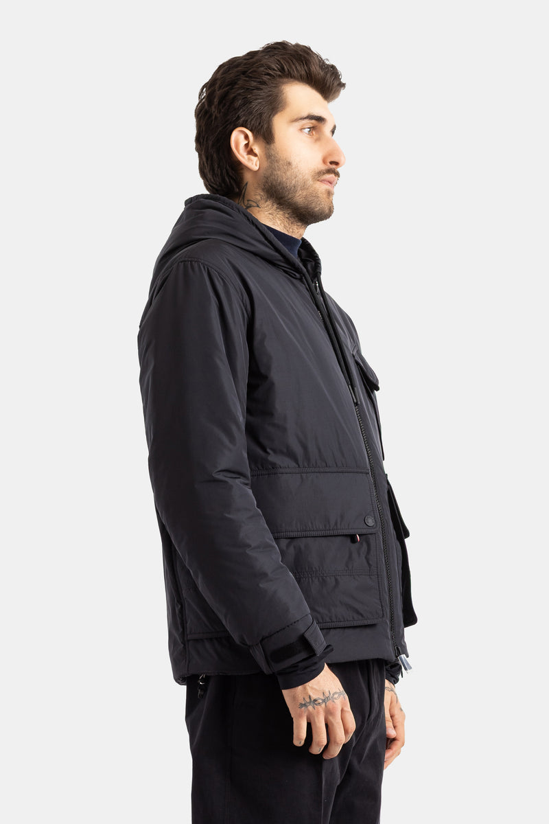 Moncler Grenoble men's black Ober jacket side profile with quilted finish, hood and large front pocket.