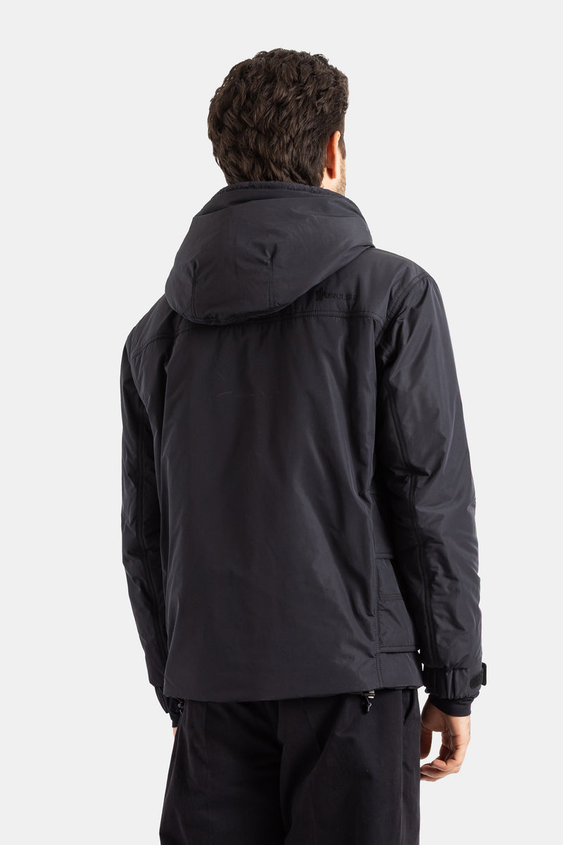 Moncler Grenoble men's Ober jacket back view showing bulky hood, tone-on-tone logo and black stitching.