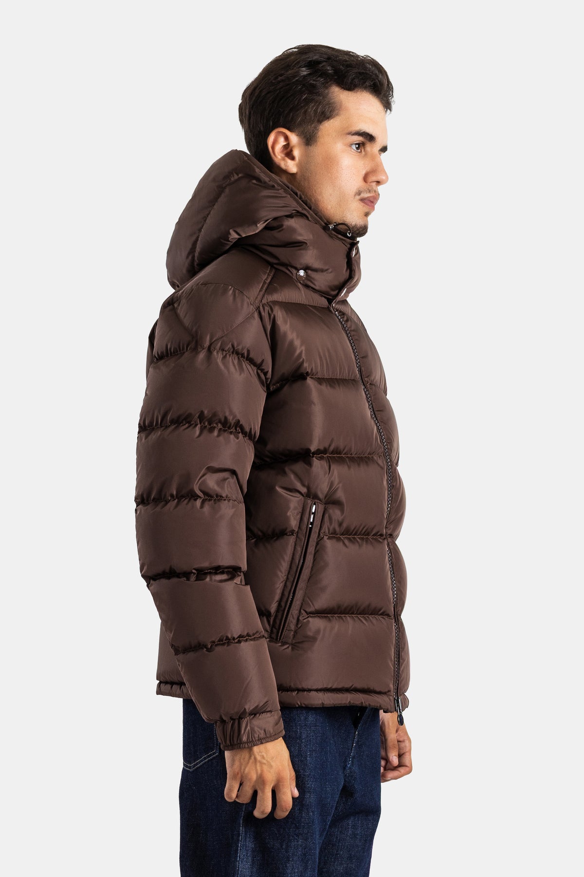Moncler Maya men's short down jacket profile view with side zip and zipped pocket in dark brown color