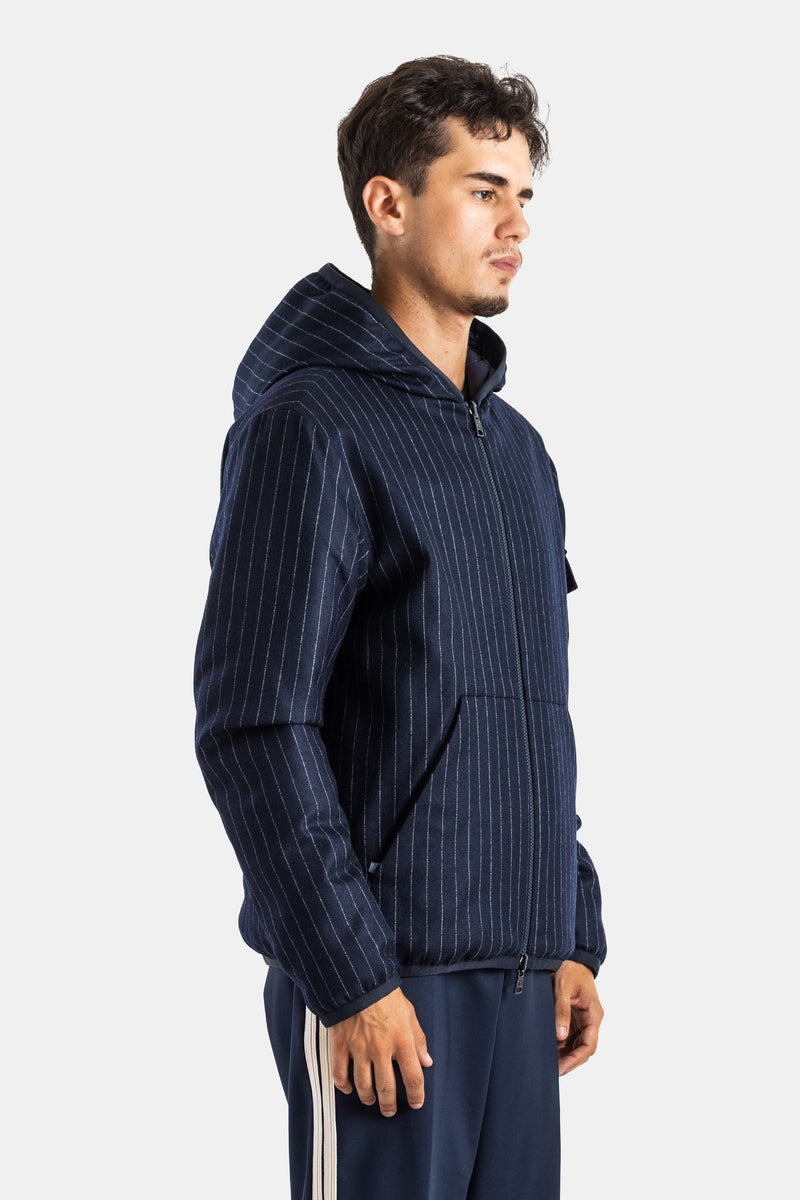 Moncler men's Ceze quilted jacket in a side view featuring a central zip, hood and navy pinstripe pattern.