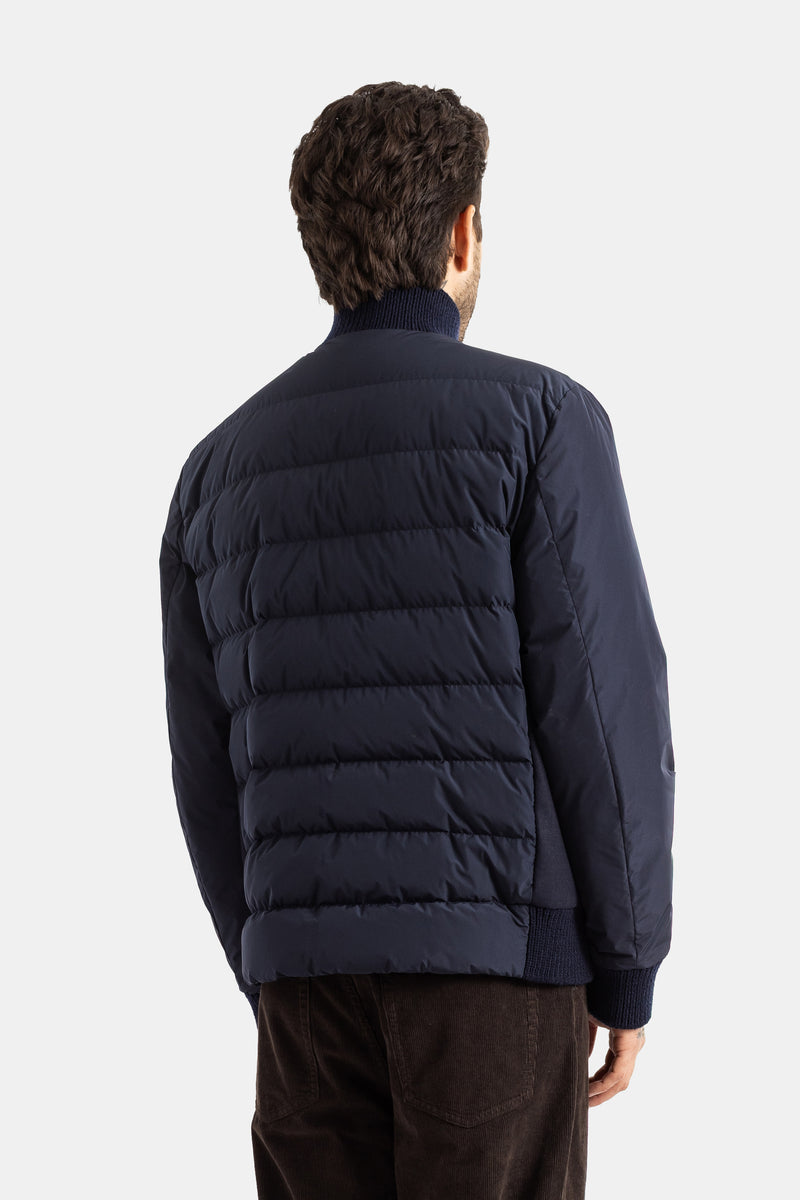 Moncler Urvalis blouson dos matelassé bleu marine bandes horizontales rembourrées col tricot homme