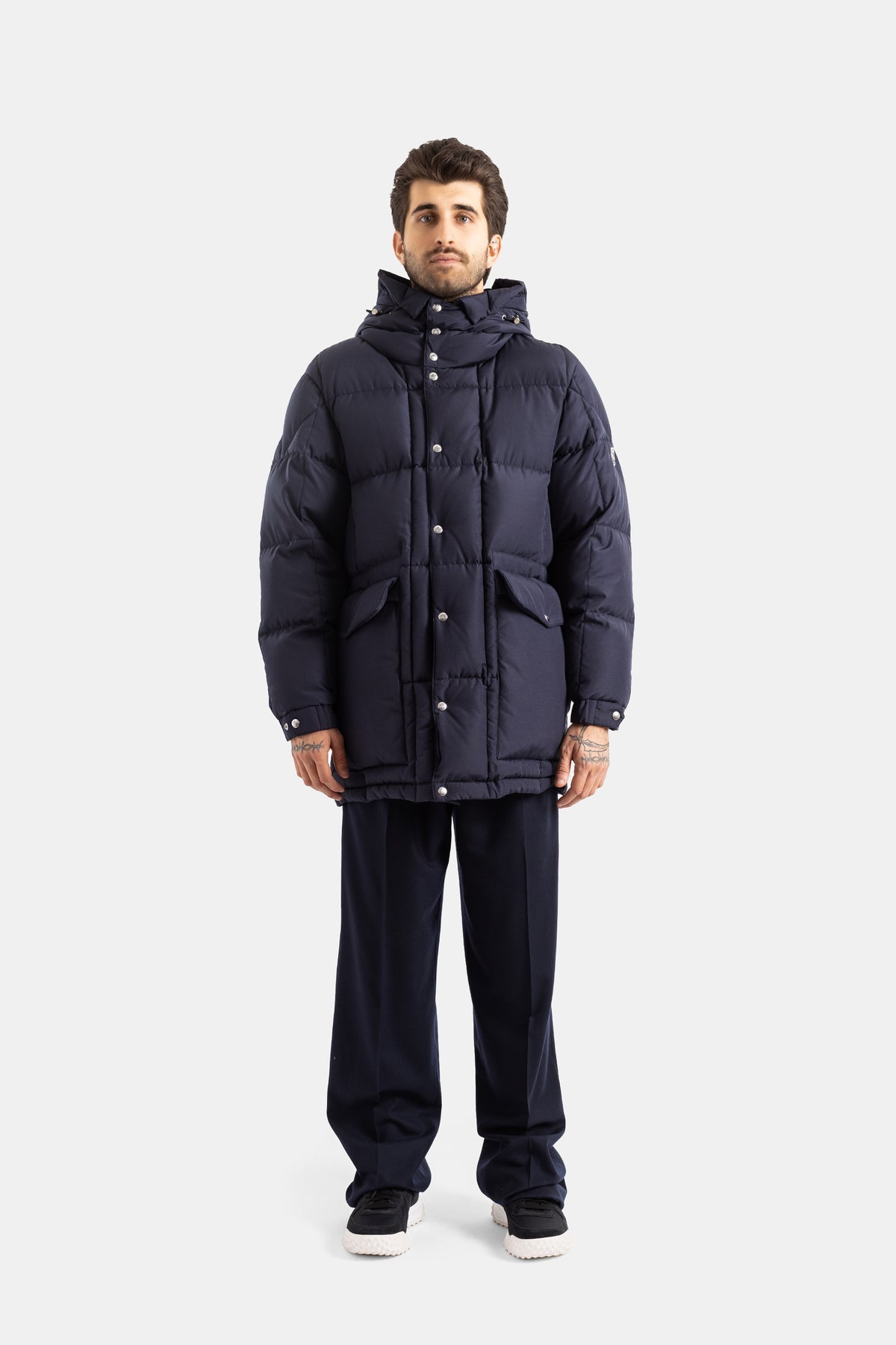 Moncler men's Sylmara long hooded down jacket featuring a quilted pattern and oversize fit in deep navy blue