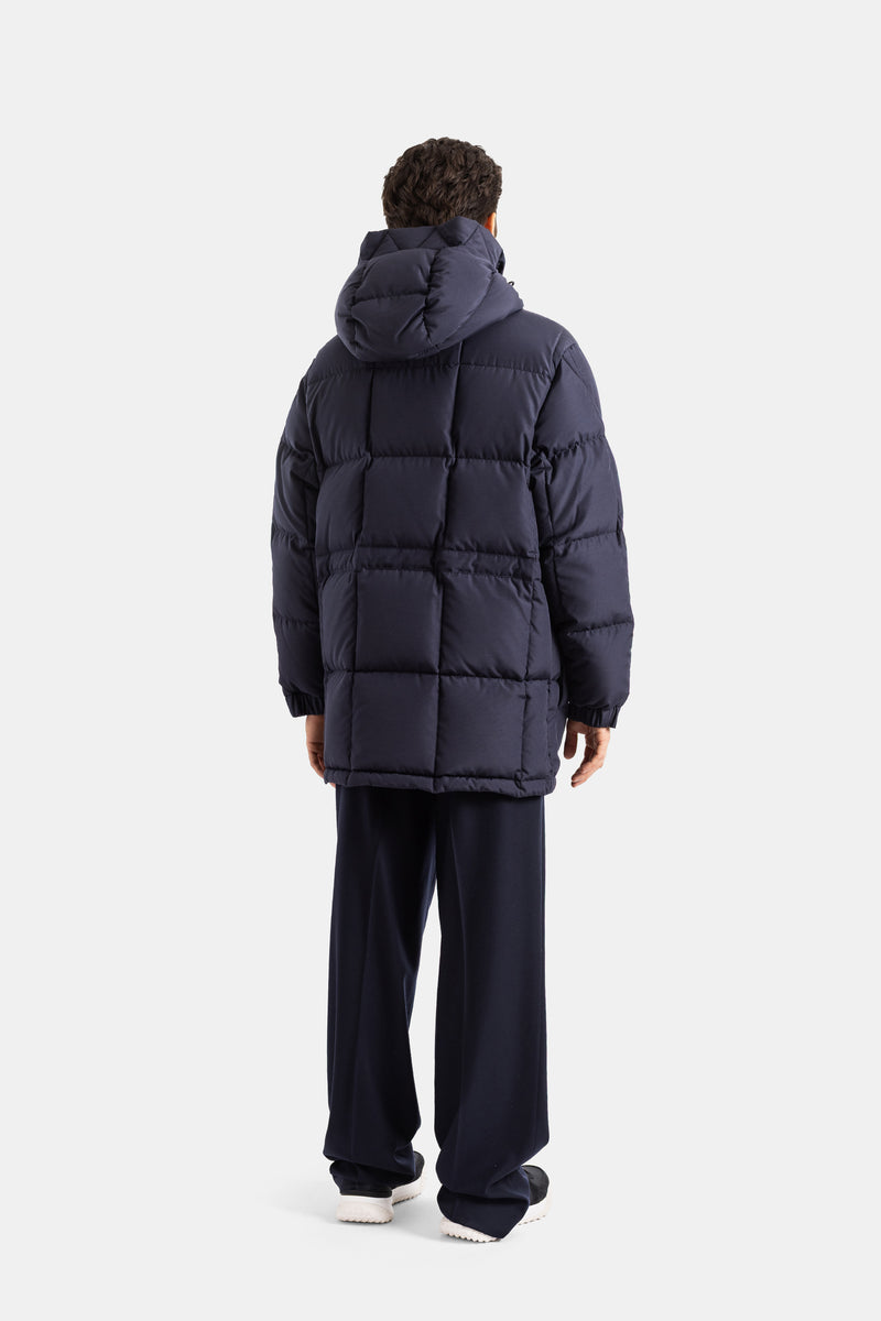 Moncler Sylmara back view of men's long down jacket in navy blue with square quilting and a voluminous hood