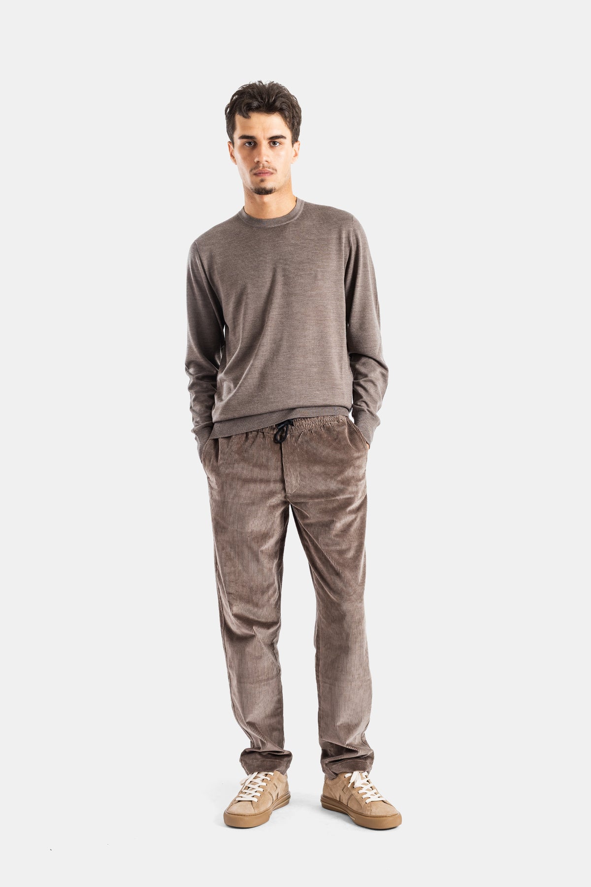 Sease Mindset men's taupe corduroy trousers styled with a crewneck sweater and beige low-top sneakers