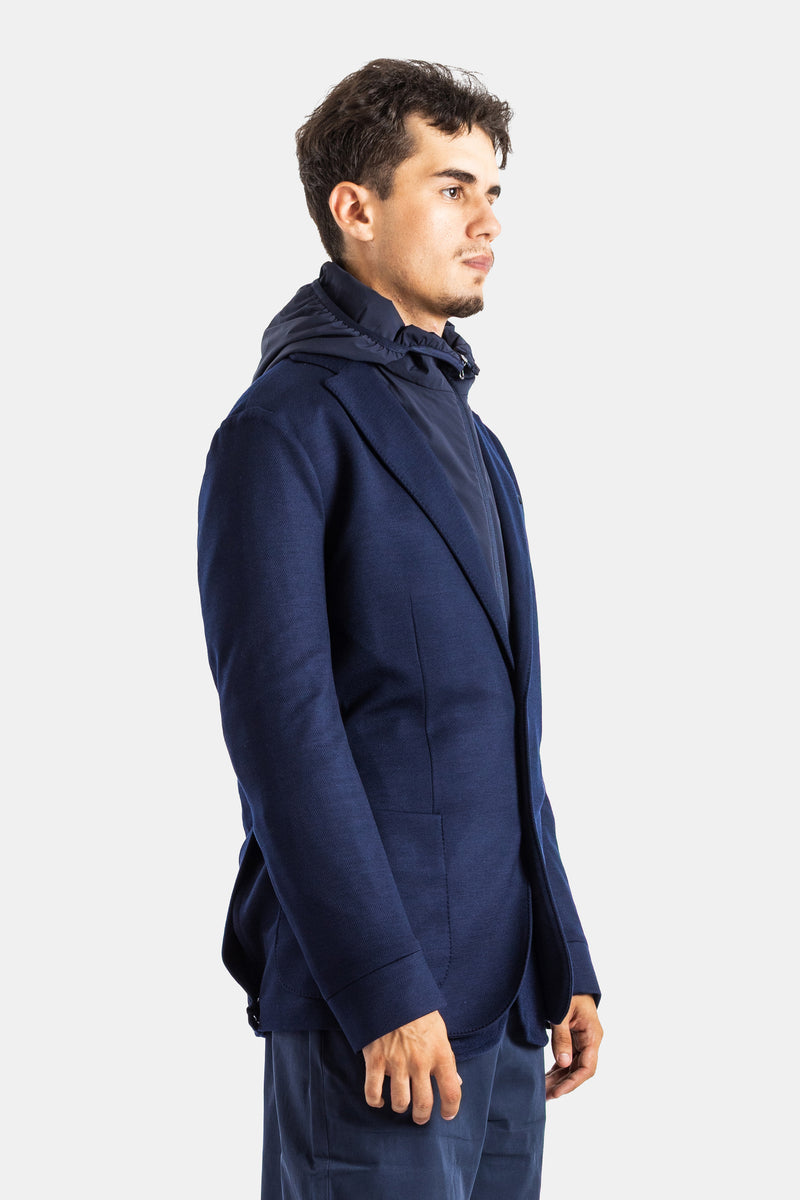 Left profile view of Sease navy blue men's blazer in technical jersey with slim fit and detachable hood.