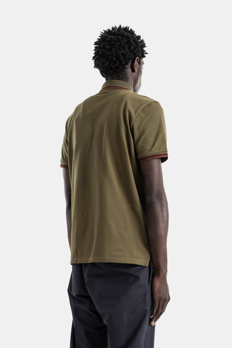 Olive khaki piqué cotton polo shirt with burgundy trim on collar and cuffs