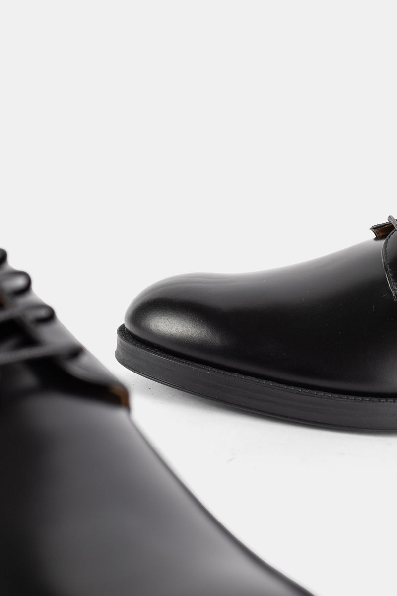 Derby lacée en cuir poli noir
