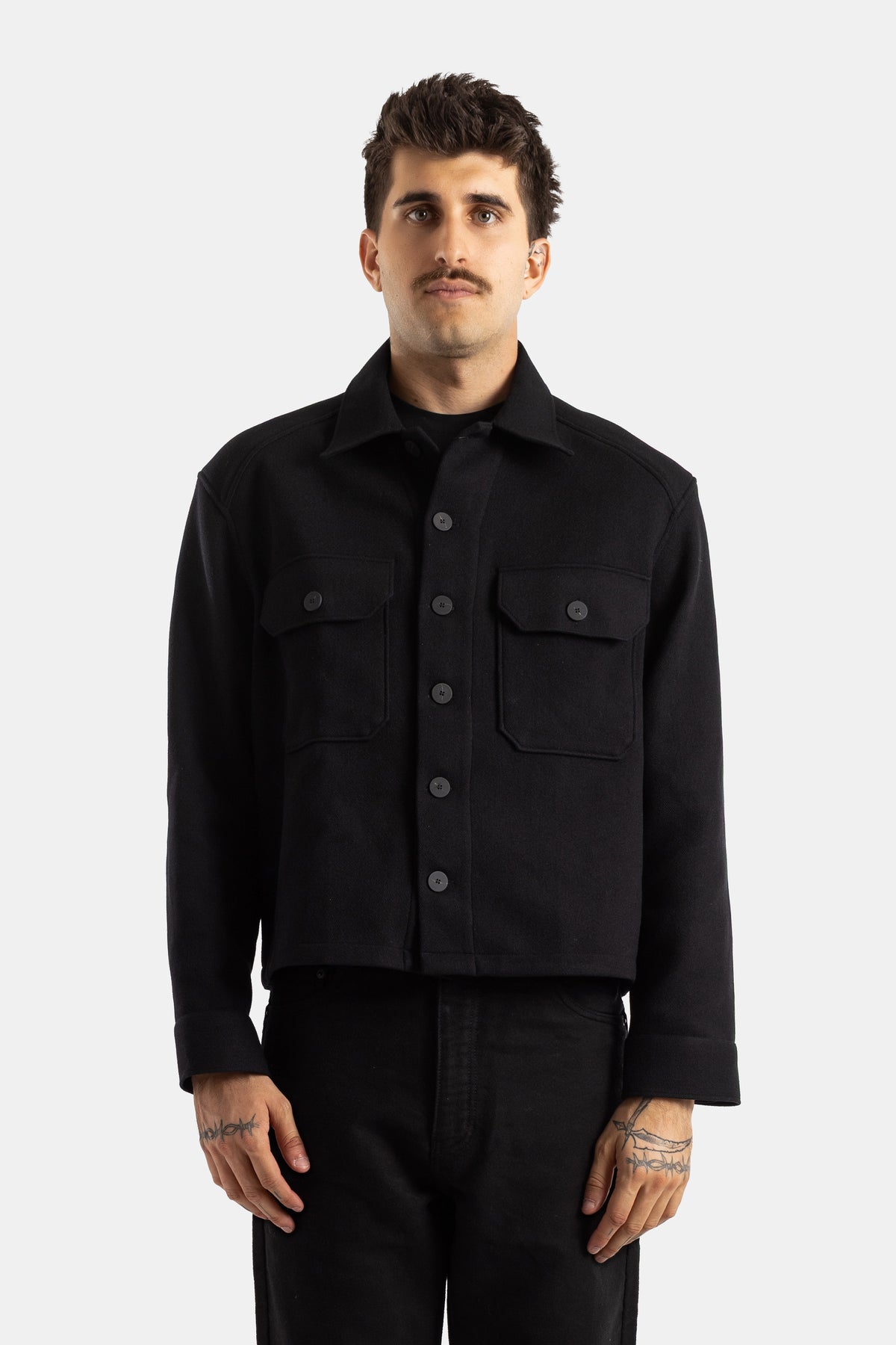 Studio Nicholson black wool Kelver short shirt-jacket with loose fit, classic collar and patch pockets