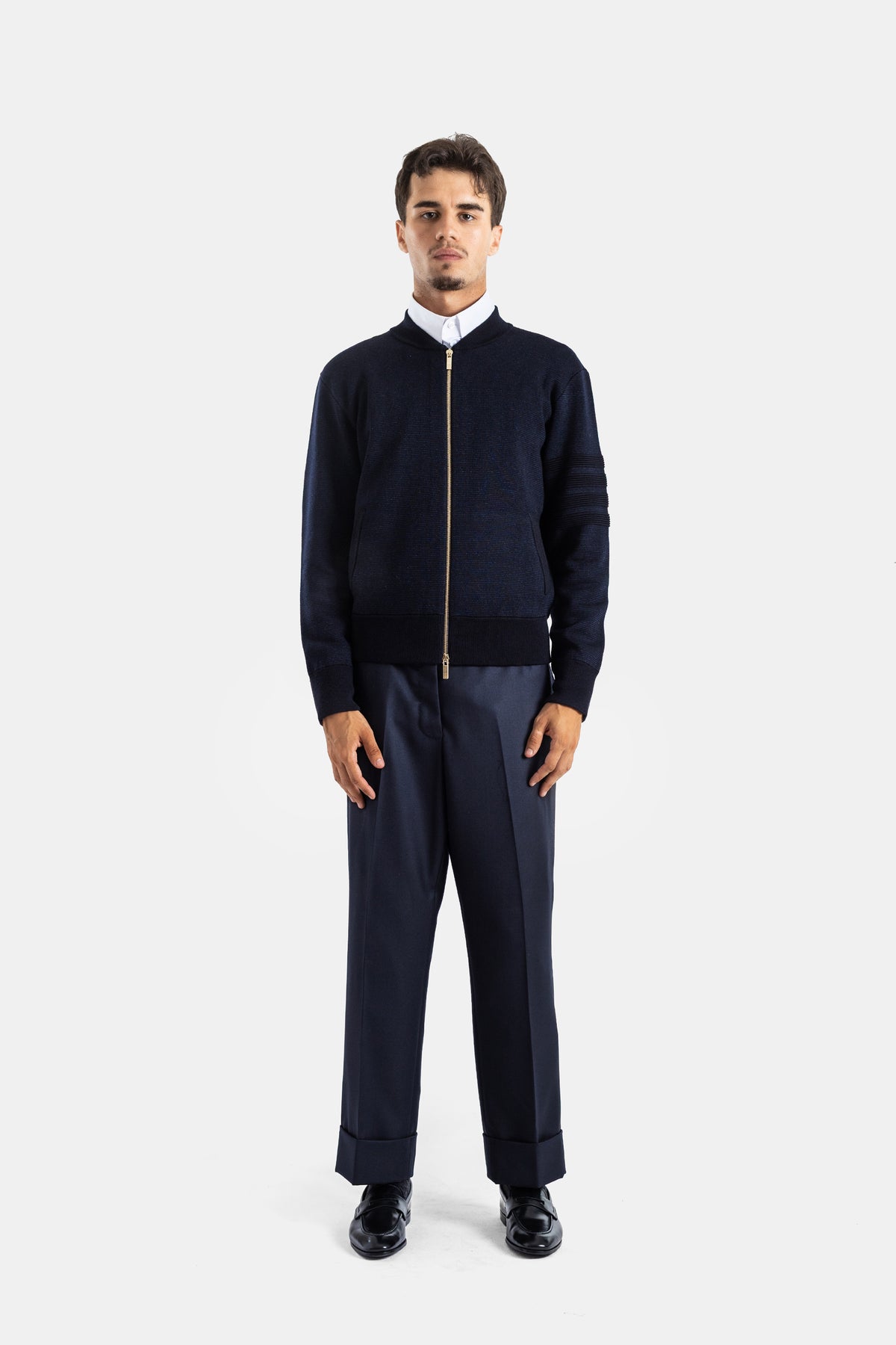Thom Browne ensemble tenue marine pantalon à revers et bomber laine mérinos zippé look masculin élégant