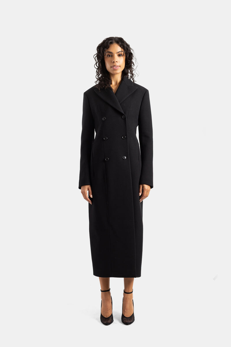 Maison Alaïa cappotto lungo doppiopetto sciancrato con collo a rever strutturato in lana nera da donna