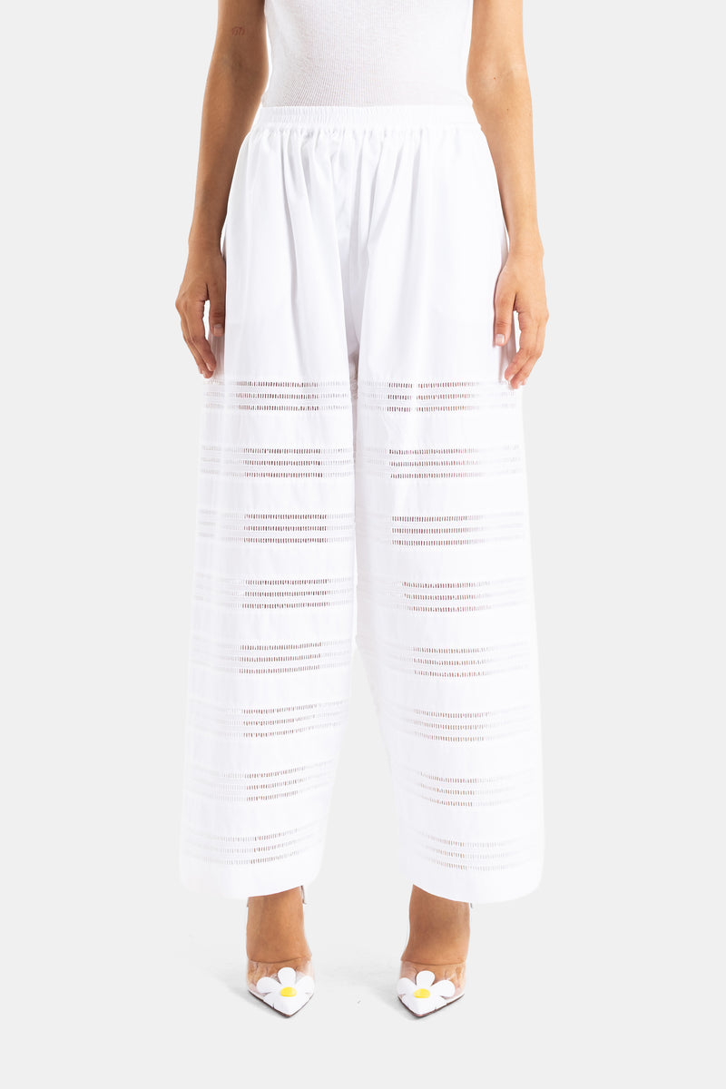 Maison Alaïa pantalon palazzo blanc en popeline de coton ajourée coupe ample taille haute
