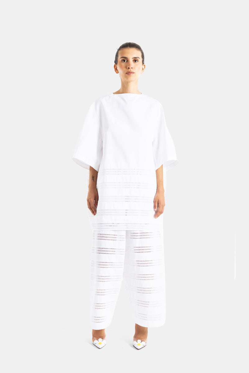 Maison Alaïa ensemble coordonné blanc popeline ajourée look total white porté face escarpins fleurs