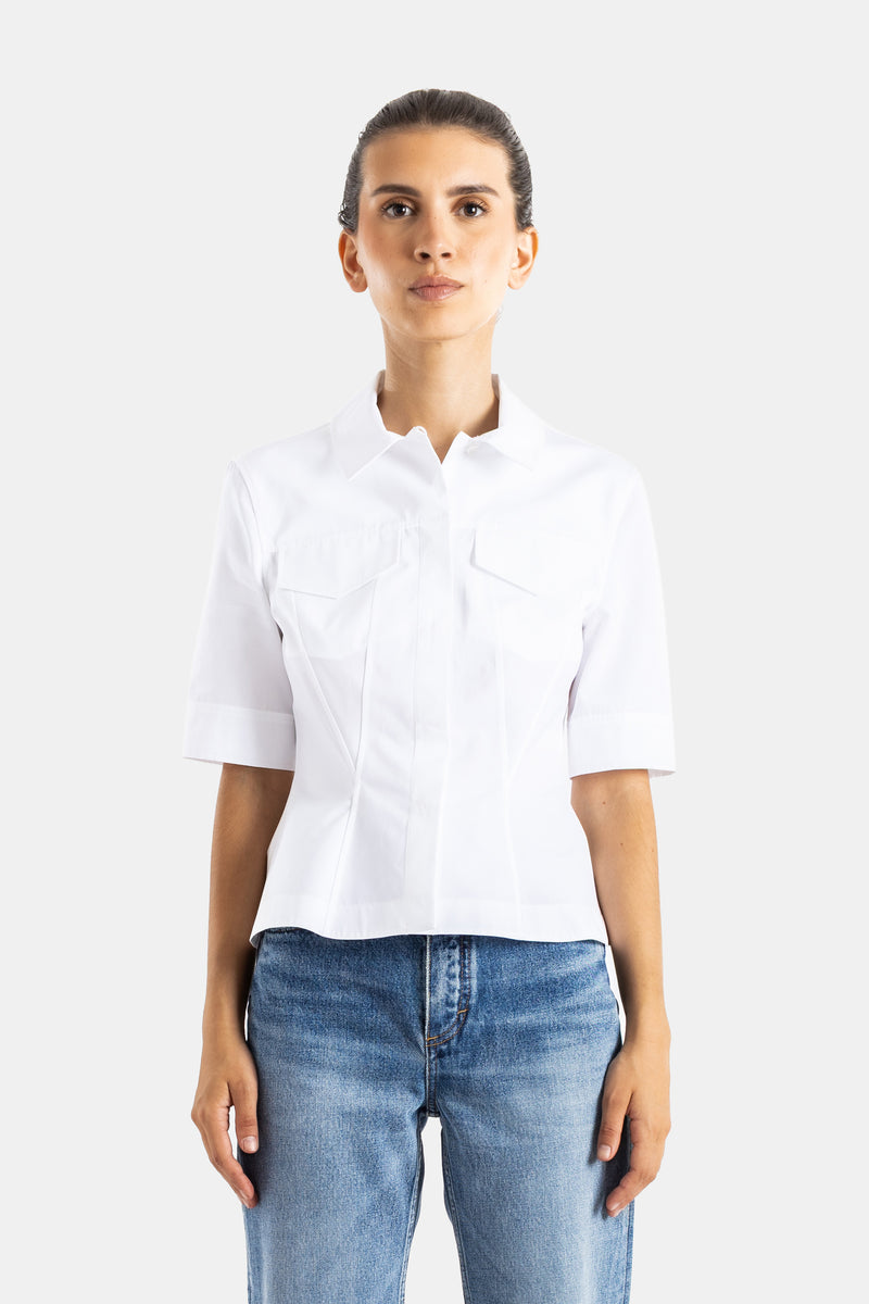 Maison Alaïa top structuré blanc en coton, coupe courte ajustée, col ondulé et manches courtes à revers