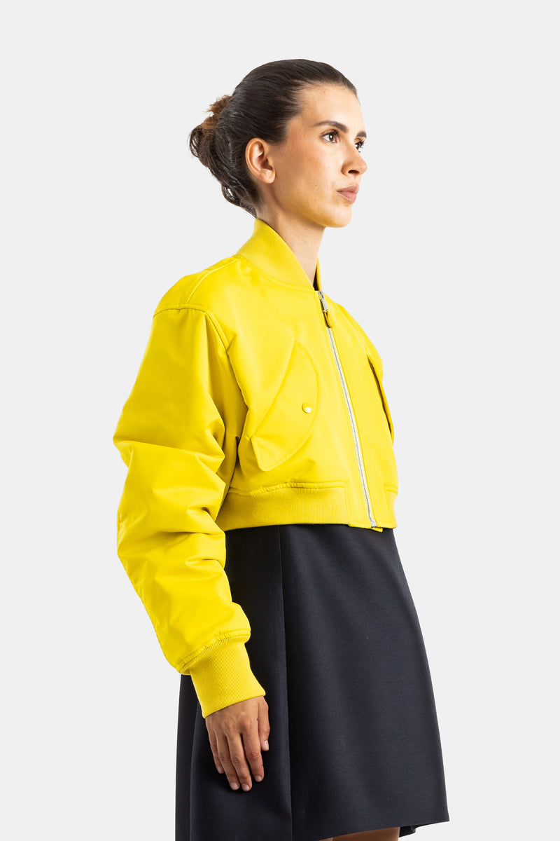 Balenciaga blouson bomber jaune cuir synthétique profil femme, col côtelé et manches oversize