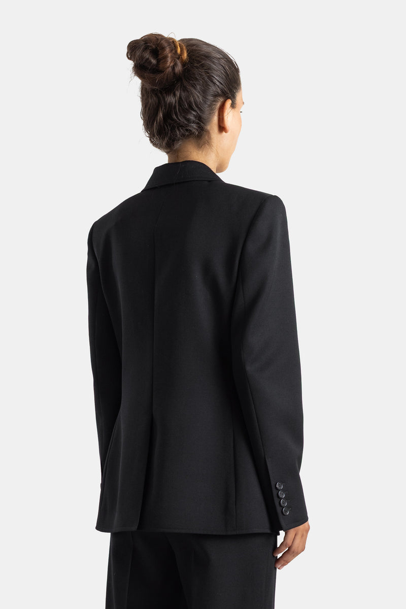 Chloé veste femme noire dos, coupe structurée en laine avec coutures verticales et boutons sur manchettes