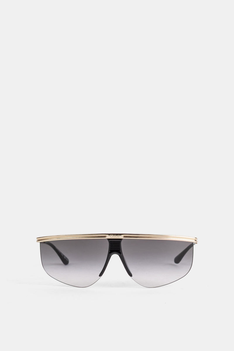 Gafas de sol de máscara Chloé con montura dorada y lentes degradadas gris ahumado con diseño de pantalla
