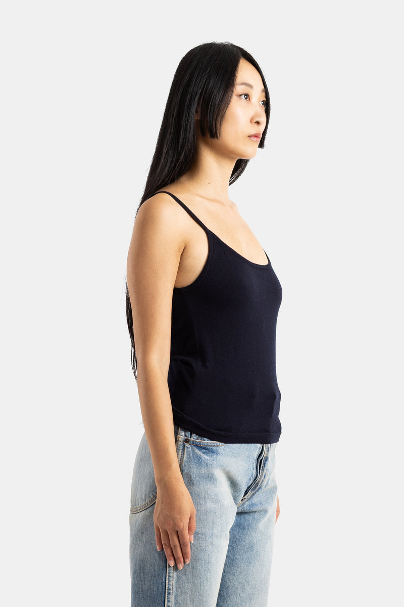 Extreme Cashmere Britney profile view in navy blue cashmere with thin straps worn with washed jeans women