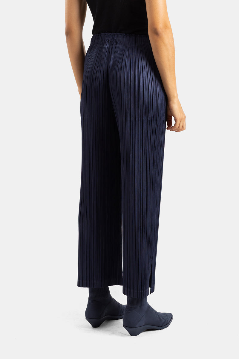 Pantaloni plissettati blu navy Pleats Please Issey Miyake, retro con vita elastica e spacchi sul fondo, donna.