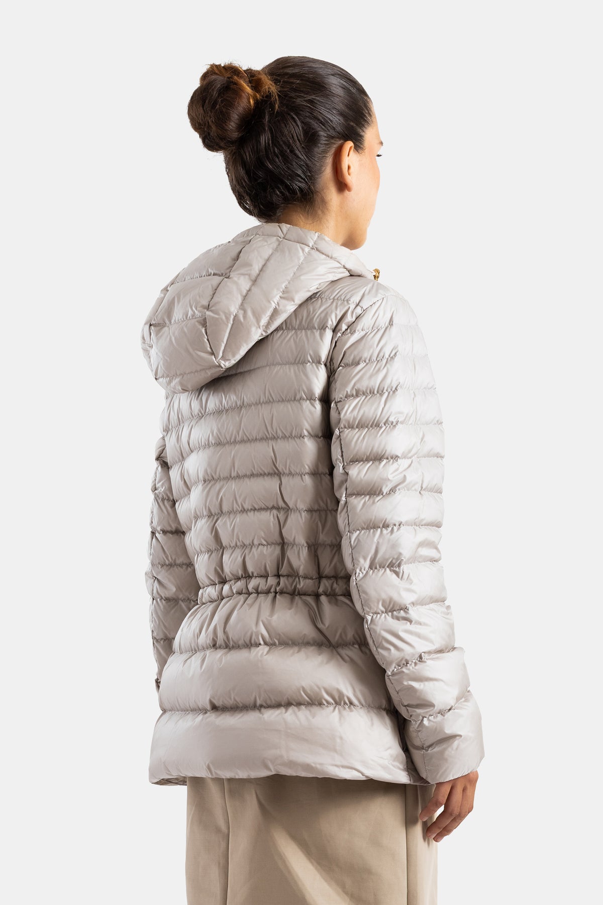 Moncler women's down jacket back view, quilted hood, diamond patterns, cinched drawstring waist, pearly powder beige