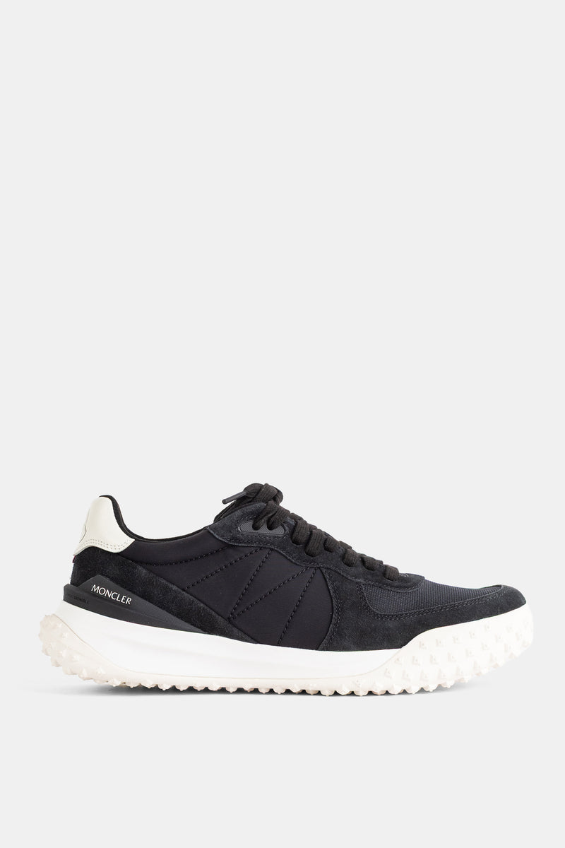 Moncler City Trek low-top men's sneakers in black technical nylon and suede with a white lugged sole.