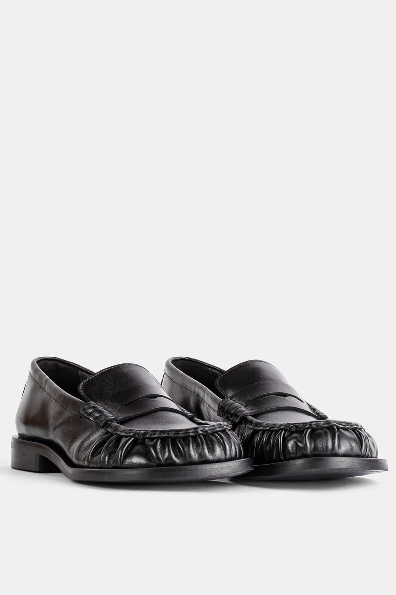 Mocassins en cuir noir à bout froncé