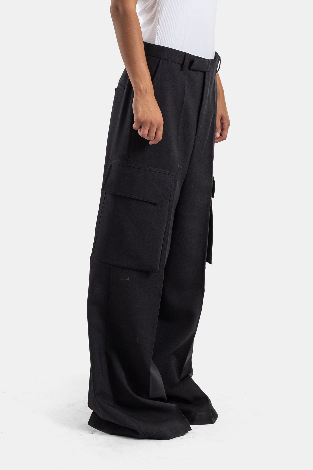 Rick Owens women's ultra-wide leg cargo trousers in black, side view showing the belt and tone-on-tone stitching